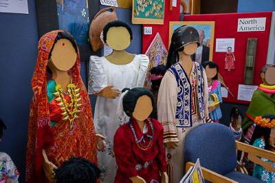 Manikins dressed in a variety of clothes from different cultures are displayed.