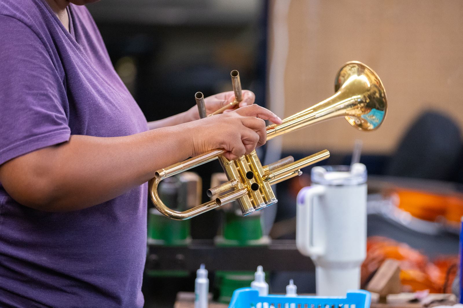 Technician repairs a trumpet